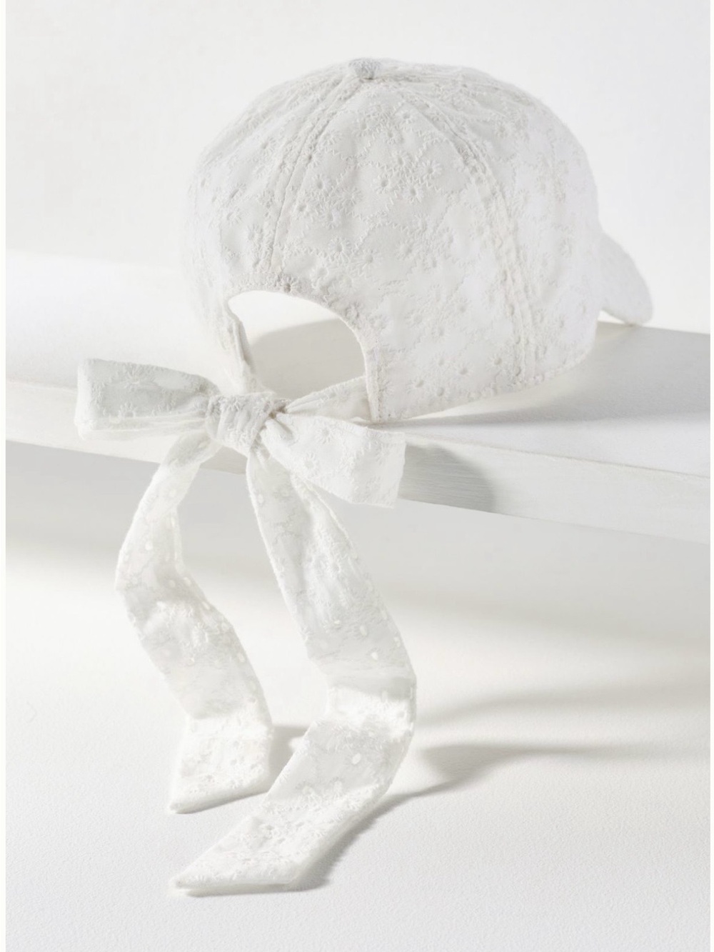 Anthropologie Eyelet Baseball Cap with Bow Back in White. One size. Brand new!
